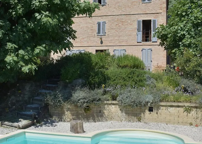 Photo de Casa Ciao Bella - Apartment Natural Green With Shared Pool Carassai